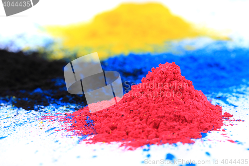 Image of cmyk toner powder (cyan, magenta, yellow, black)