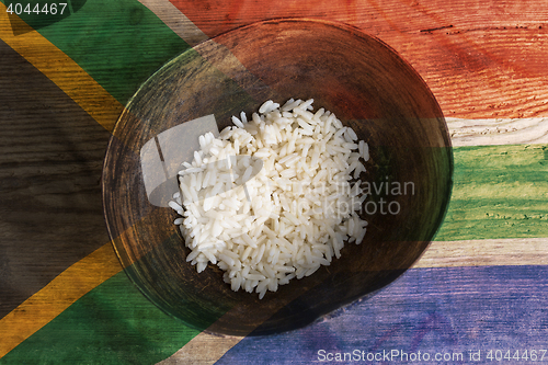 Image of Poverty concept, bowl of rice with South Africa flag      