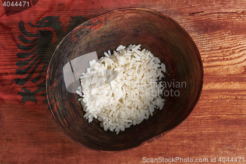 Image of Poverty concept, bowl of rice with Albanian flag      
