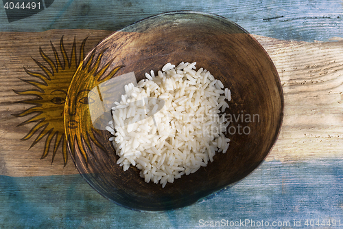 Image of Poverty concept, bowl of rice with Argentine flag      