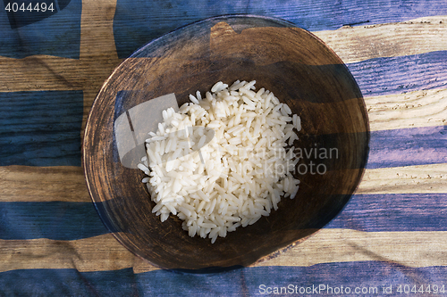 Image of Poverty concept, bowl of rice with Greek flag      