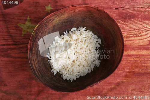Image of Poverty concept, bowl of rice with Chinese flag      