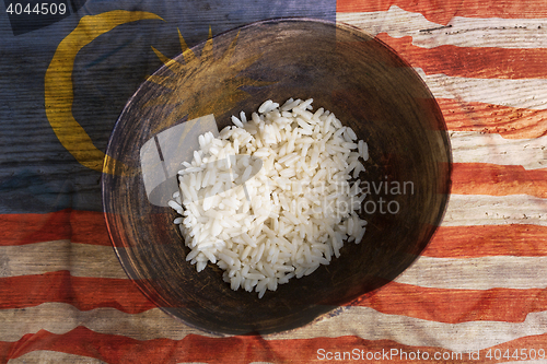 Image of Poverty concept, bowl of rice with Malaysia flag      