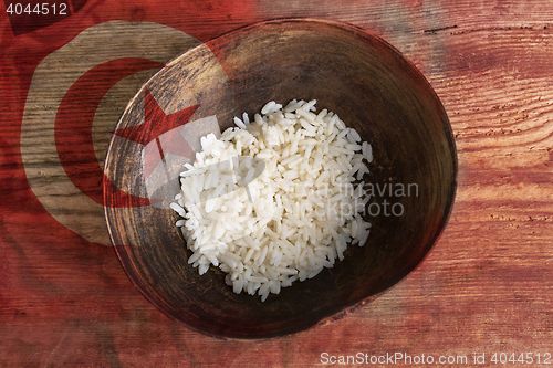 Image of Poverty concept, bowl of rice with Tunisian flag      