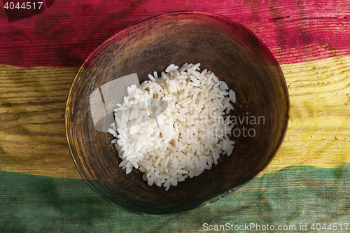 Image of Poverty concept, bowl of rice with Ghana flag      