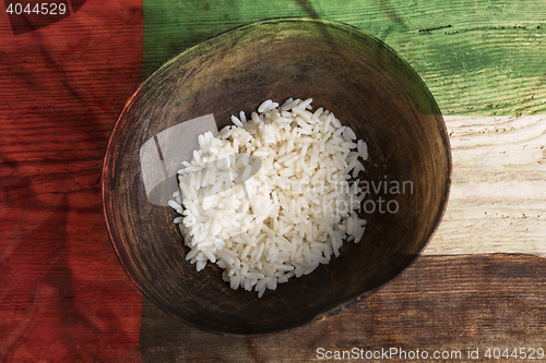 Image of Poverty concept, bowl of rice with United Arab Emirates flag    