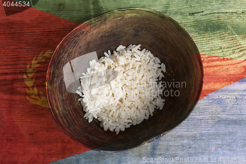 Image of Poverty concept, bowl of rice with Eritrea flag      