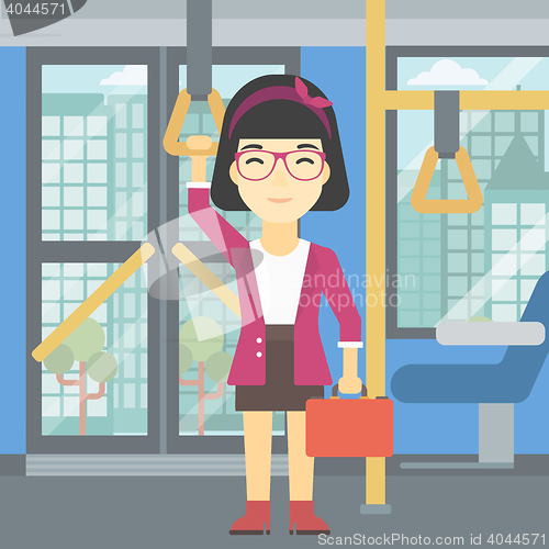 Image of Woman traveling by public transport.