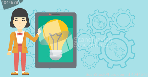 Image of Woman pointing at big tablet computer.