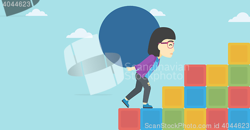 Image of Woman carrying concrete ball uphill.