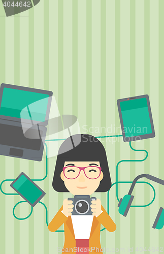 Image of Woman surrounded with her gadgets.