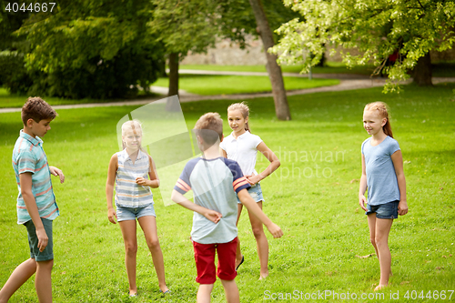 Image of happy kids playing game in summer park