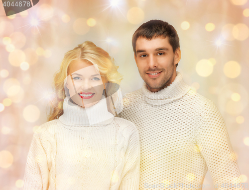 Image of happy family couple in winter clothes