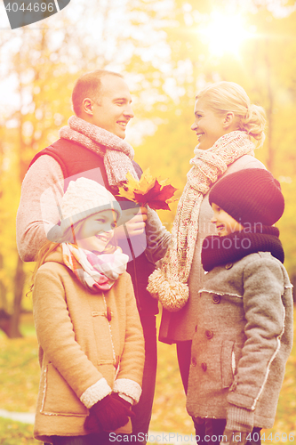 Image of happy family in autumn park