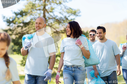 Image of group of volunteers with garbage bags in park