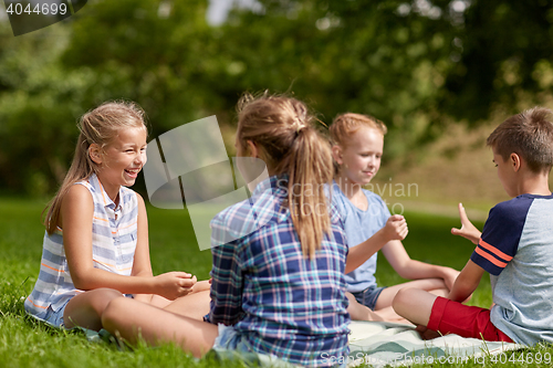 Image of happy kids playing rock-paper-scissors game