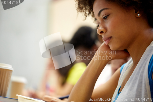 Image of close up of african student girl on lecture