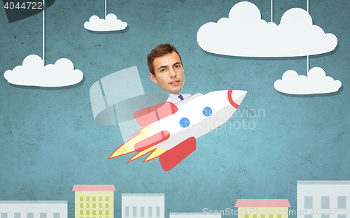 Image of businessman flying on rocket above cartoon city