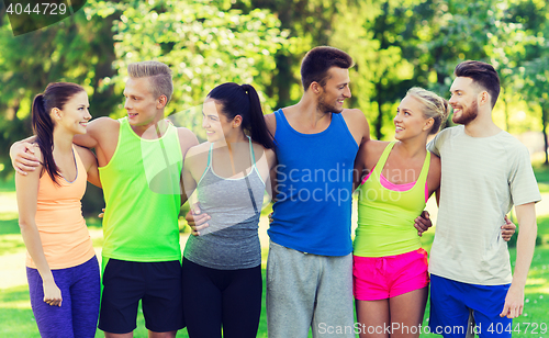 Image of group of happy friends or sportsmen outdoors