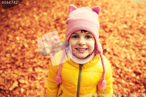 Image of happy little girl in autumn park