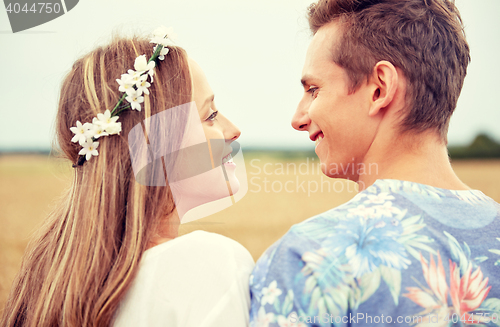 Image of happy smiling young hippie couple outdoors