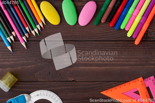 Image of School supplies on a wooden table