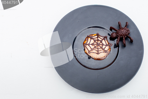 Image of waffle with chocolate spider web