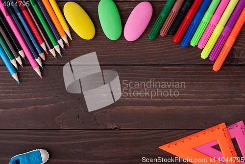 Image of School supplies on a wooden table