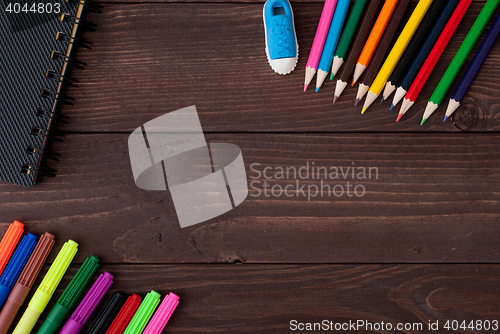 Image of School supplies on a wooden table