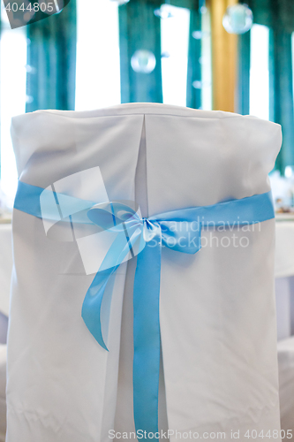 Image of Chair, beautifully decorated with ribbon