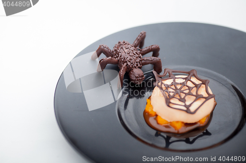 Image of waffle with chocolate spider web