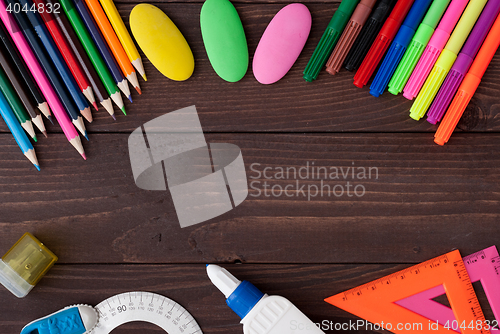 Image of School supplies on a wooden table