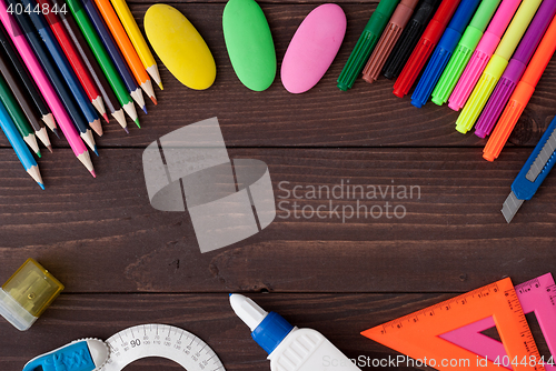 Image of School supplies on a wooden table