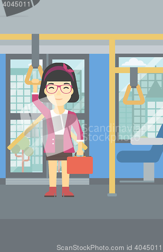 Image of Woman traveling by public transport.