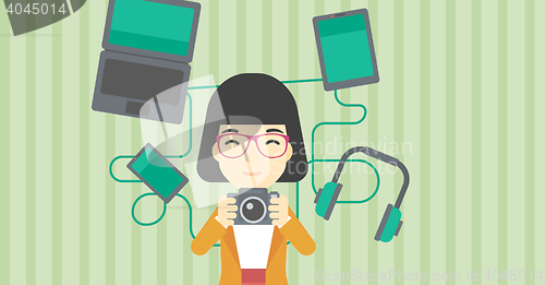 Image of Woman surrounded with her gadgets.