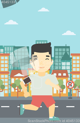 Image of Man running with earphones and smartphone.