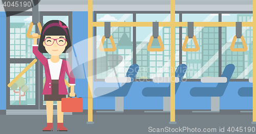 Image of Woman traveling by public transport.