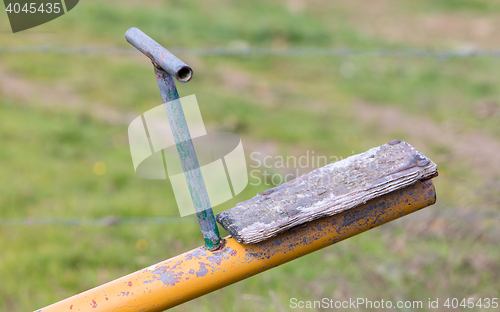 Image of Old wooden and steel seesaw