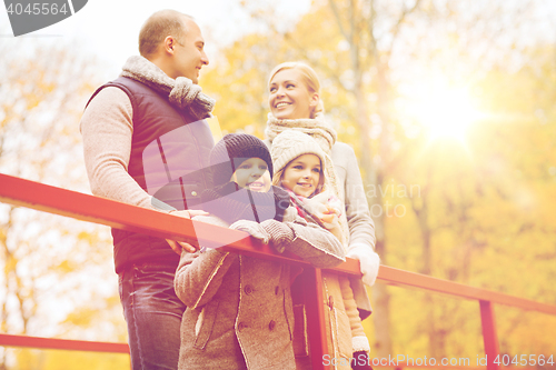 Image of happy family in autumn park