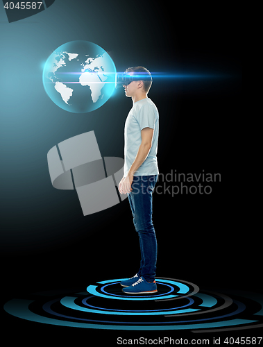 Image of happy man in virtual reality headset or 3d glasses