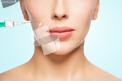 Image of woman face and syringe making injection