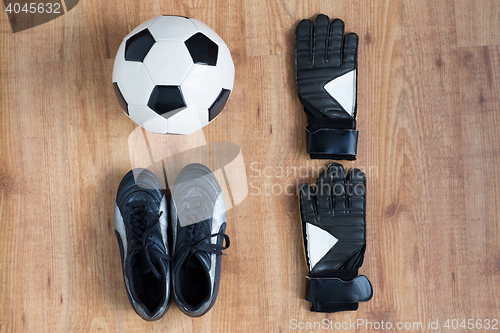 Image of close up of soccer ball, boots and gloves