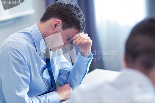 Image of business people having problem in office