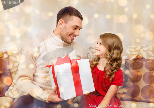 Image of smiling father and daughter looking at each other