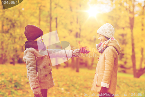 Image of smiling children in autumn park