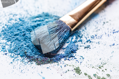 Image of scattered blue eye shadows close-up