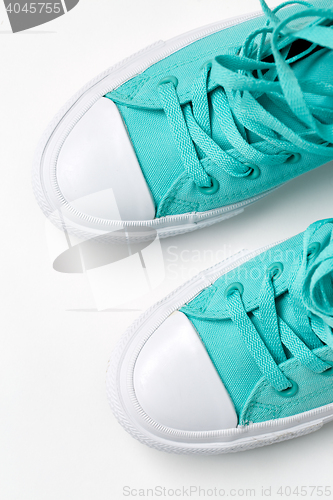 Image of Top view of sneakers on white background.