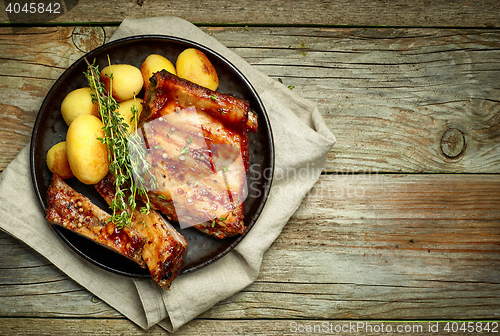 Image of grilled pork ribs and potatoes