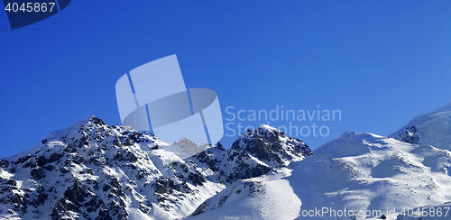 Image of Panoramic view on snow mountains and off-piste slope on sunny da