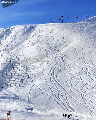 Image of Off-piste slope with trace from ski and snowboard at sun morning